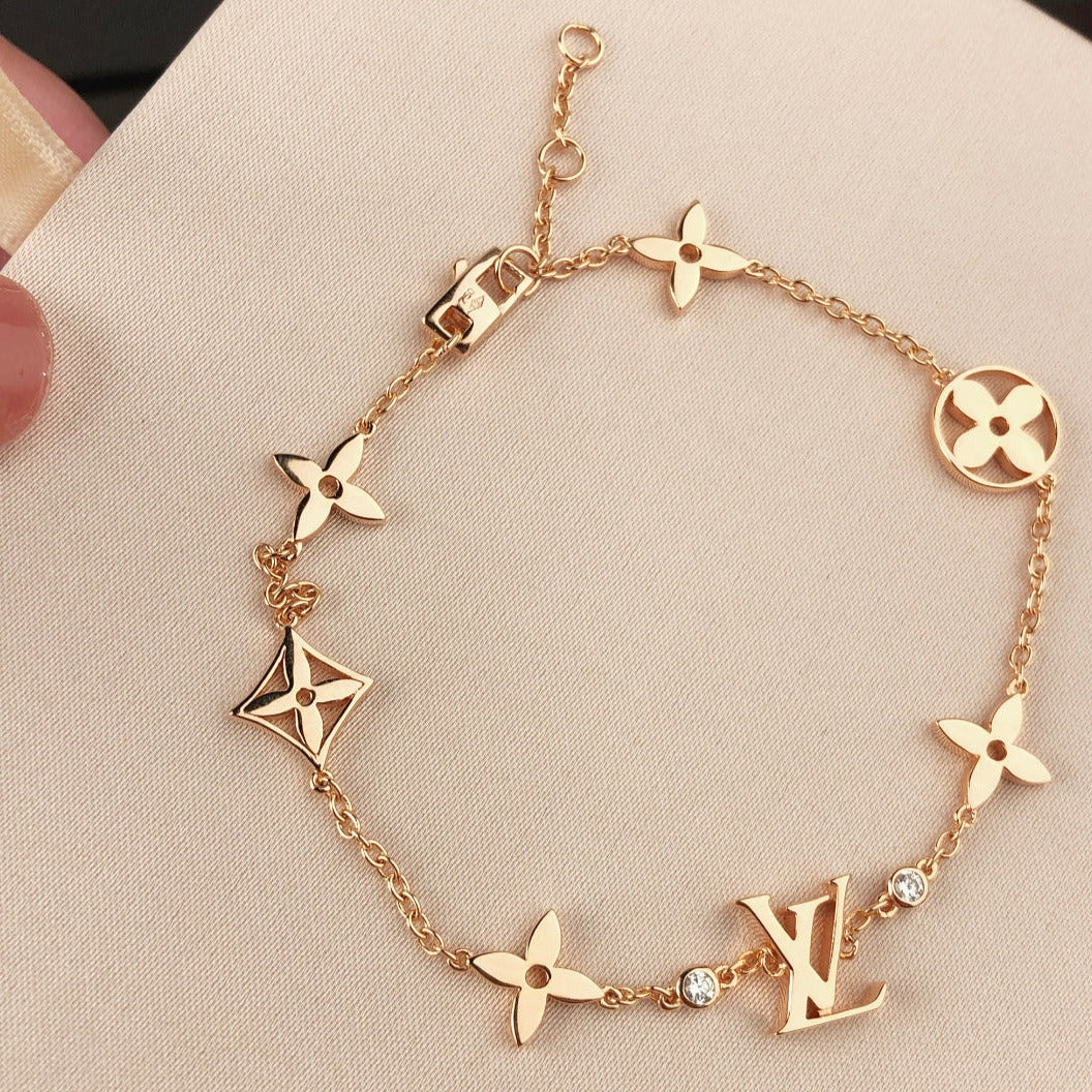 [ヴィッキー]星と太陽 7モチーフ ゴールドブレスレット